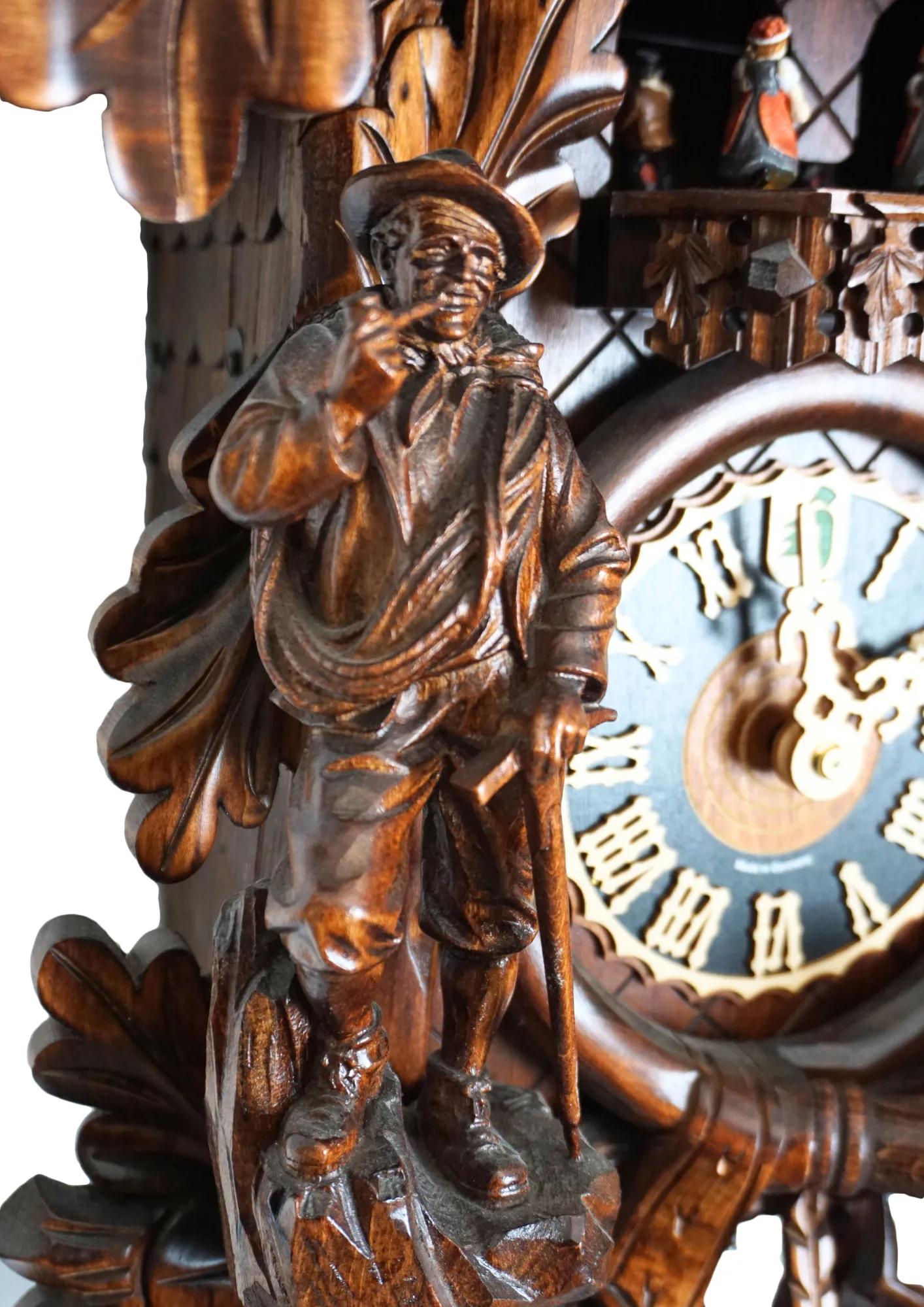 Cuckoo Clock Majestic Eagle 8 Days Movement with Music (4) Precisely hand carved wildlife mechanical brown tradtional black forest clock, decorated with a majestic eagle, mountain goat and the rock climber. The clock plays music on the full hour and the dancers turn. This is one of the nicest tradtional cuckoo cl