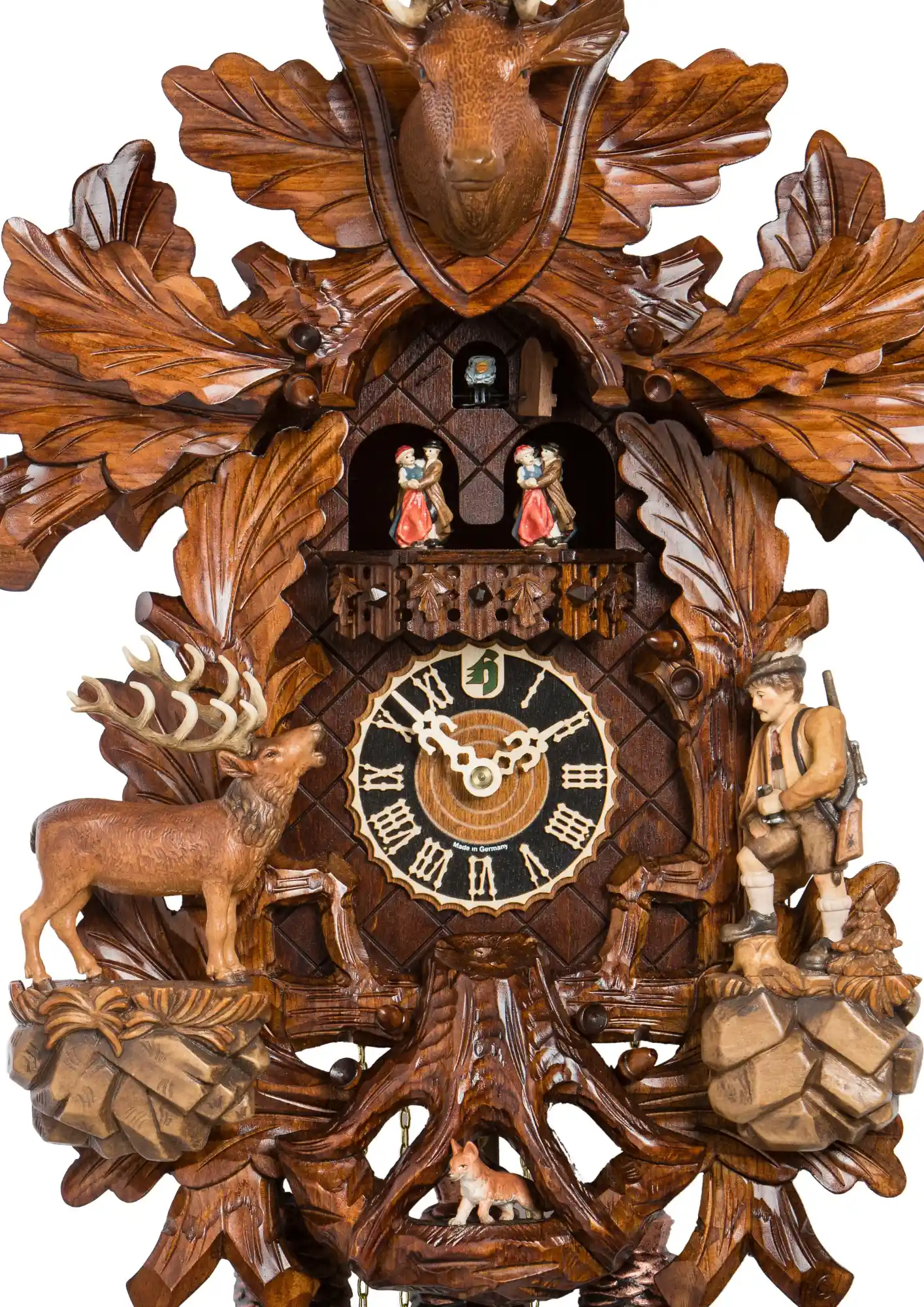 Cuckoo Clock Elk Hunt 8 Day Movement with Music (3) This lovely brown mechanical black forest cuckoo clock shows a hunter moving his binoculars up and down, searcing for an elk. Hand carved three root is also hiding a little fox which is a cute adition to this clock. Dancers dance and the hunter is rising