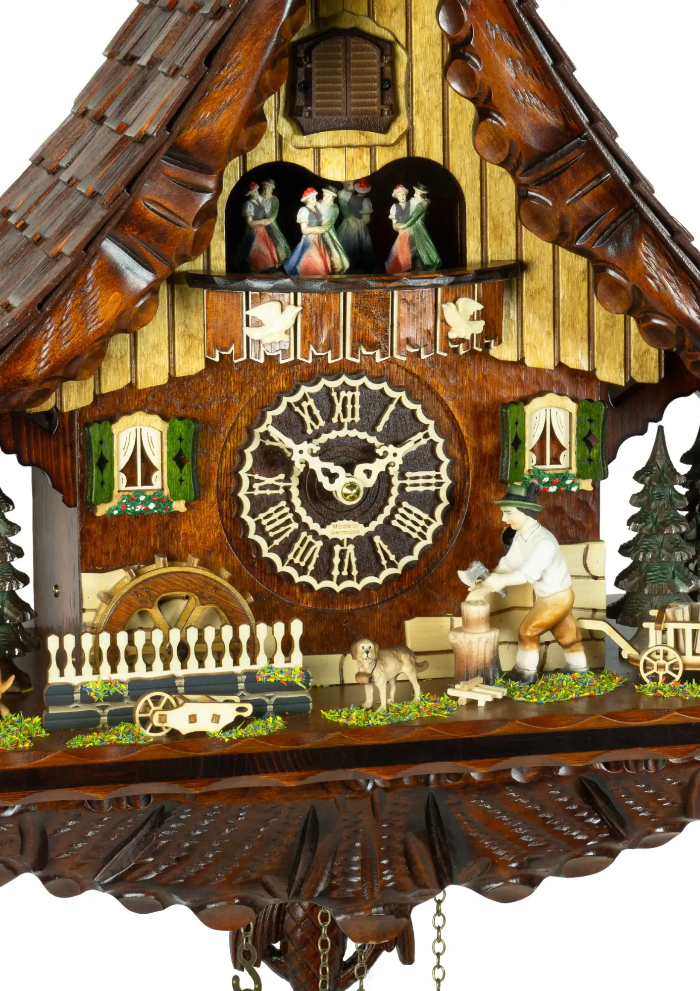 Battery Black Forest cuckoo clock with a wood chopper and a dog in front of the chalet house plays music and wood chopper moves made by Trenkle Uhren