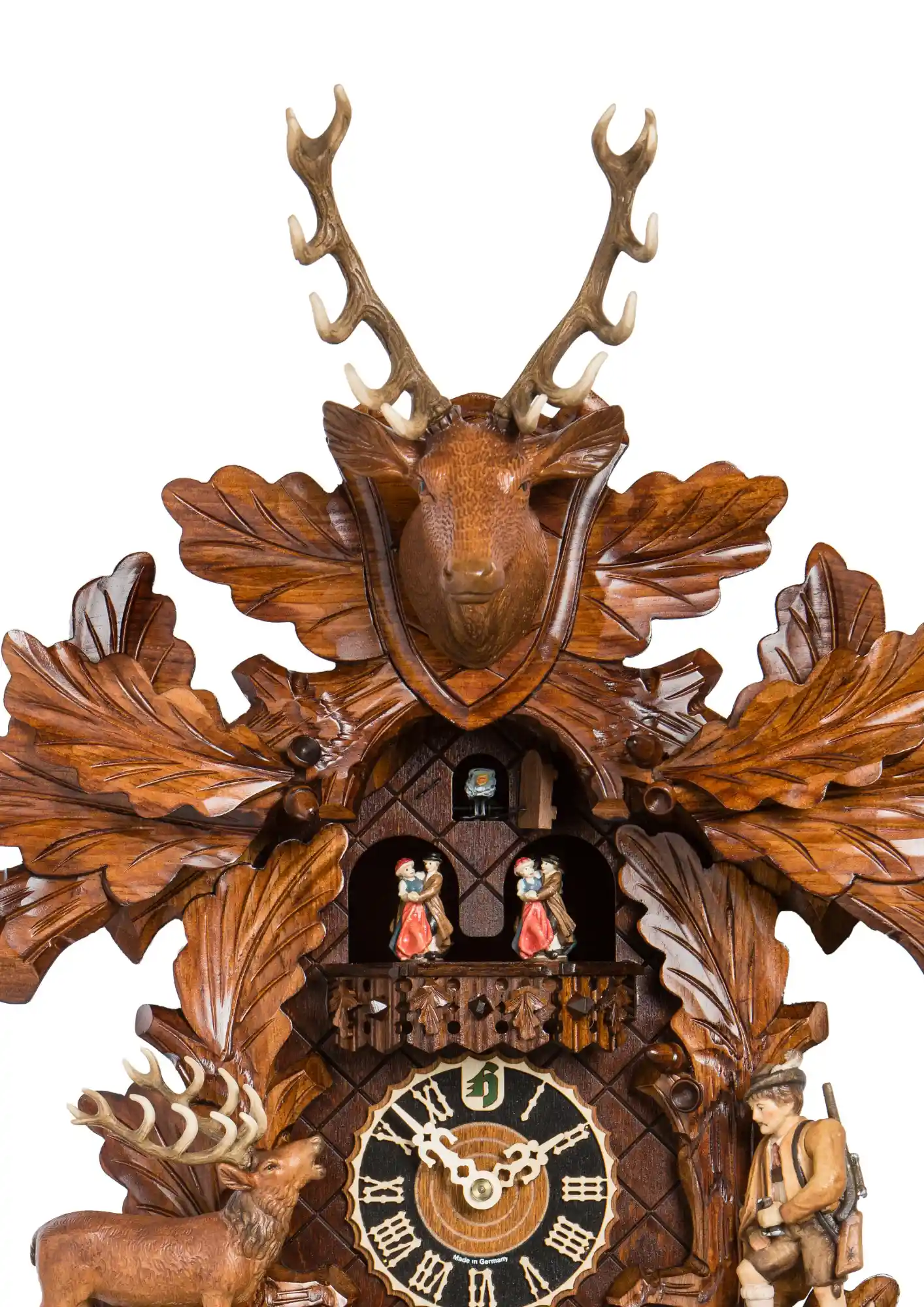 Cuckoo Clock Elk Hunt 8 Day Movement with Music (2) This lovely brown mechanical black forest cuckoo clock shows a hunter moving his binoculars up and down, searcing for an elk. Hand carved three root is also hiding a little fox which is a cute adition to this clock. Dancers dance and the hunter is rising