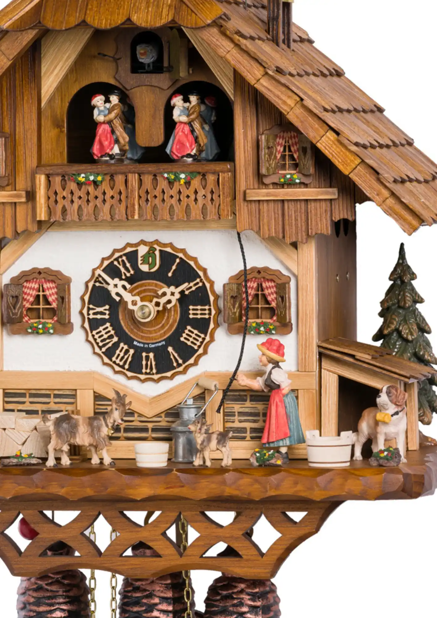 Cuckoo Clock Schoolhouse Bell Ringer 8 Day Movement with Music (2) This cuckoo clock shows a Black Forest lady in a traditional dress with "Bollenhut" ringing a bell, calling children to come and start their school hours. The lady rings the bell with every cuckoo chime. Dancers dance, water wheel turns as the music is pl