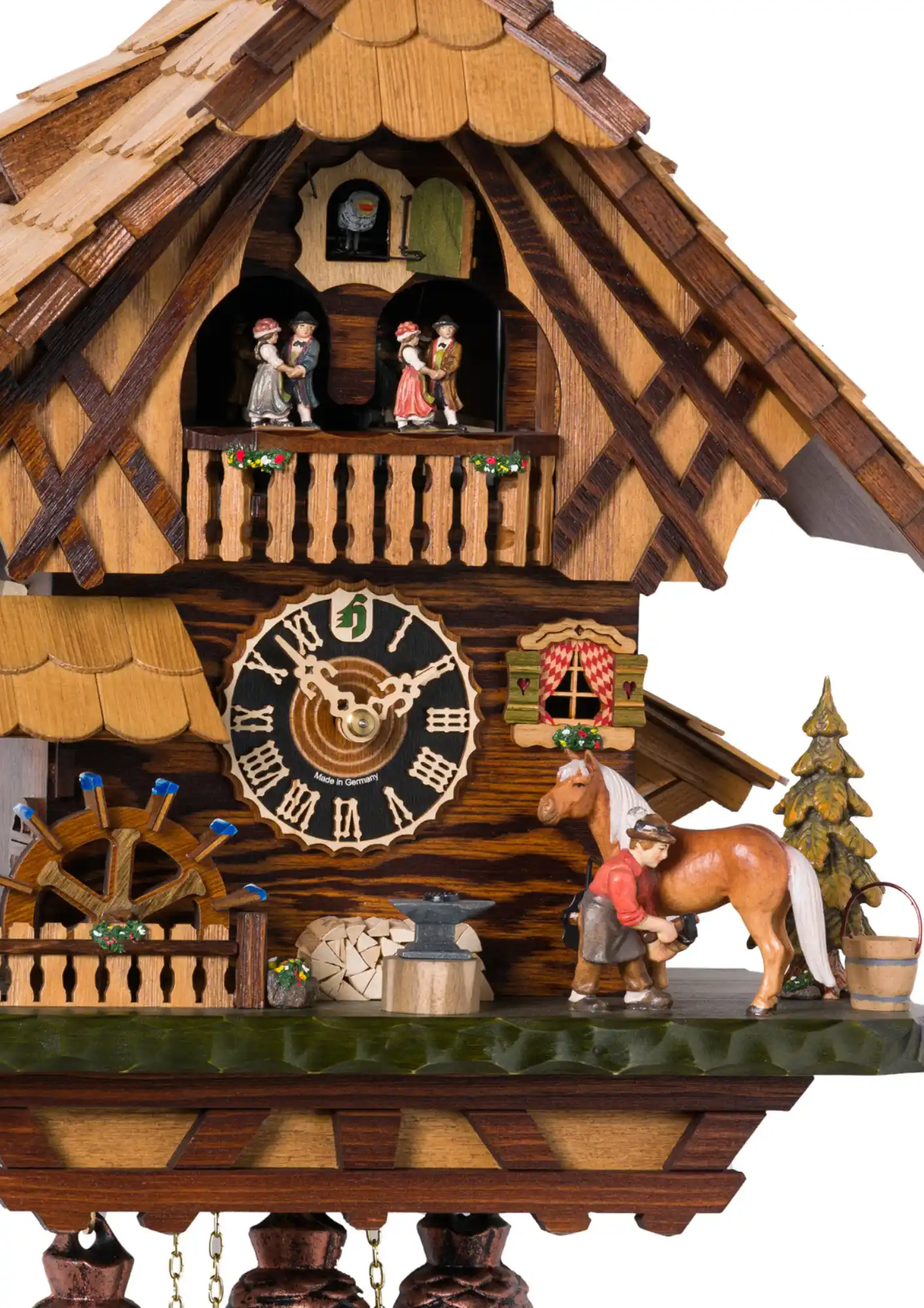 Cuckoo Clock Horseshoer 8 Day Movement with Music (2) This colorful black forest mechanical 8 day cuckoo clock shows blacksmither at his work, shoeing a horse in front of the Black Forest chalet house. Dancers dance, water wheel is turning and the blacksmither is hitting the horse shoe while the music is pla