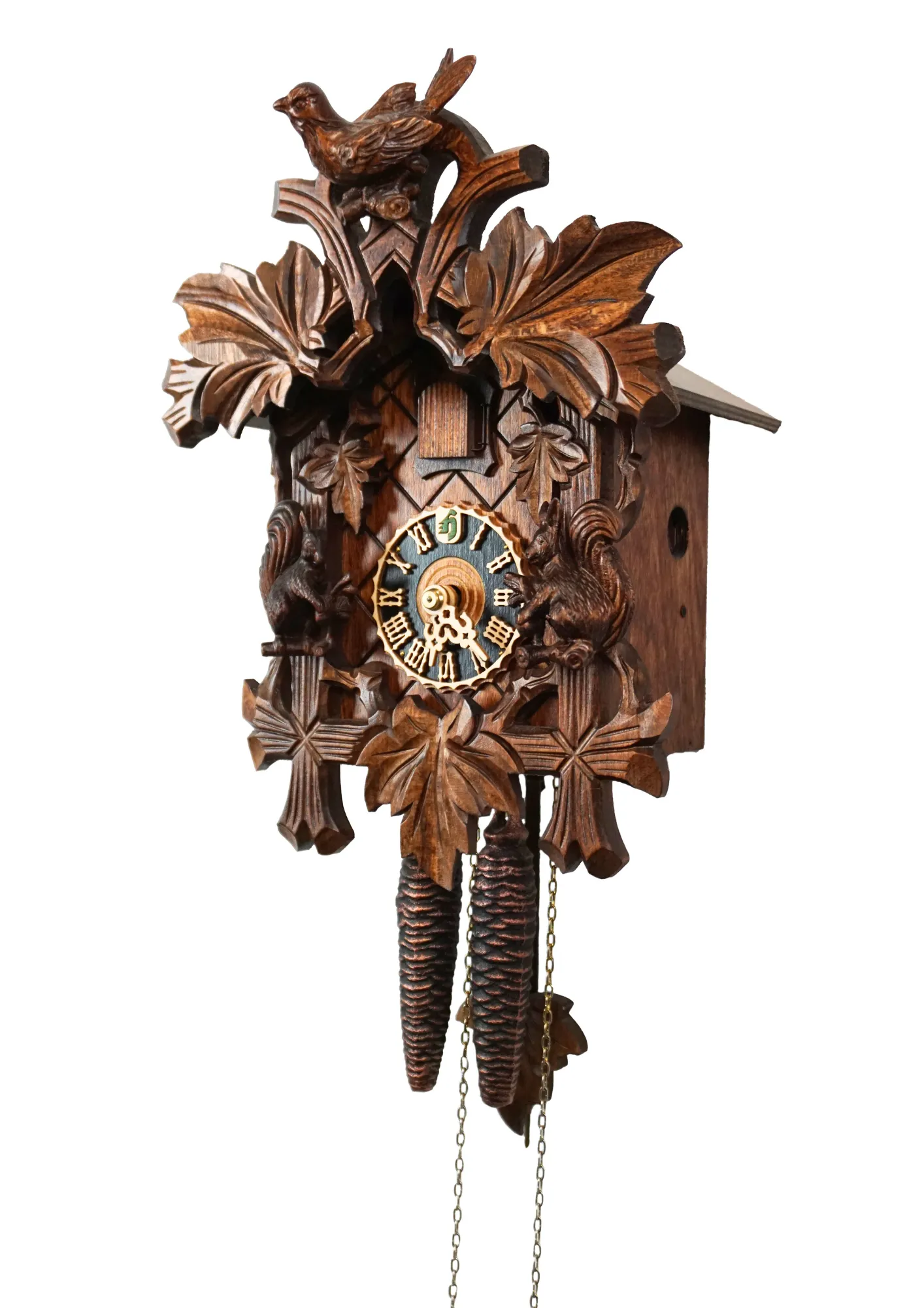 Hand carved traditional mechanical brown black forest cuckoo clock with squirrels and cuckoo bird carvings made by Hönes