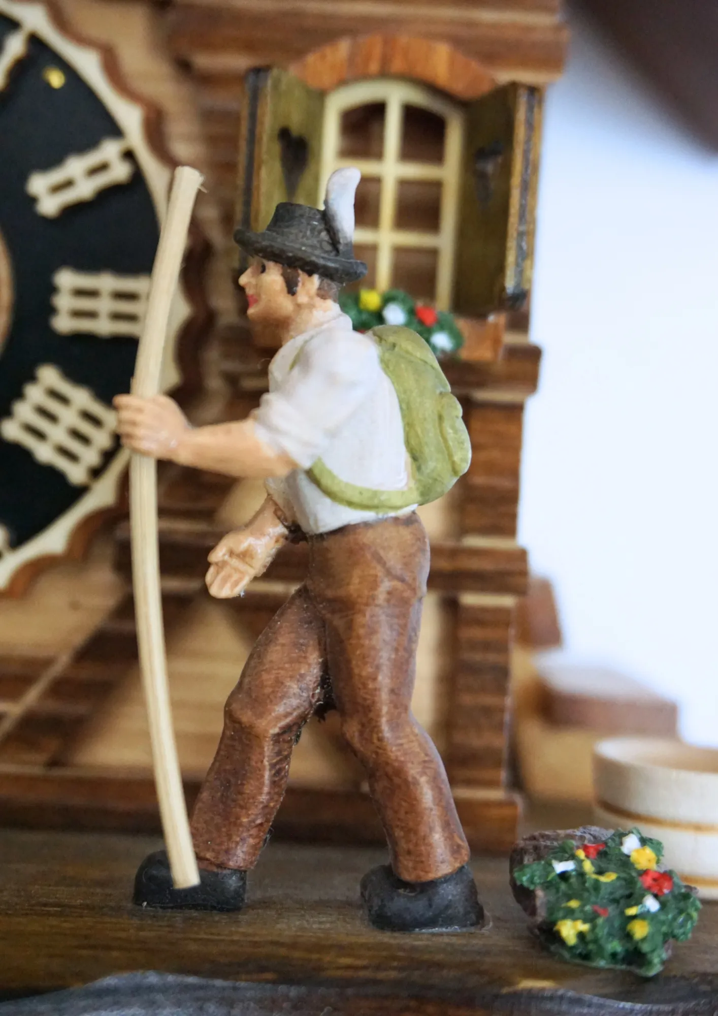 One day clockwork cuckoo clock in Chalet style depicting walk throught the Black Forest made by Hönes