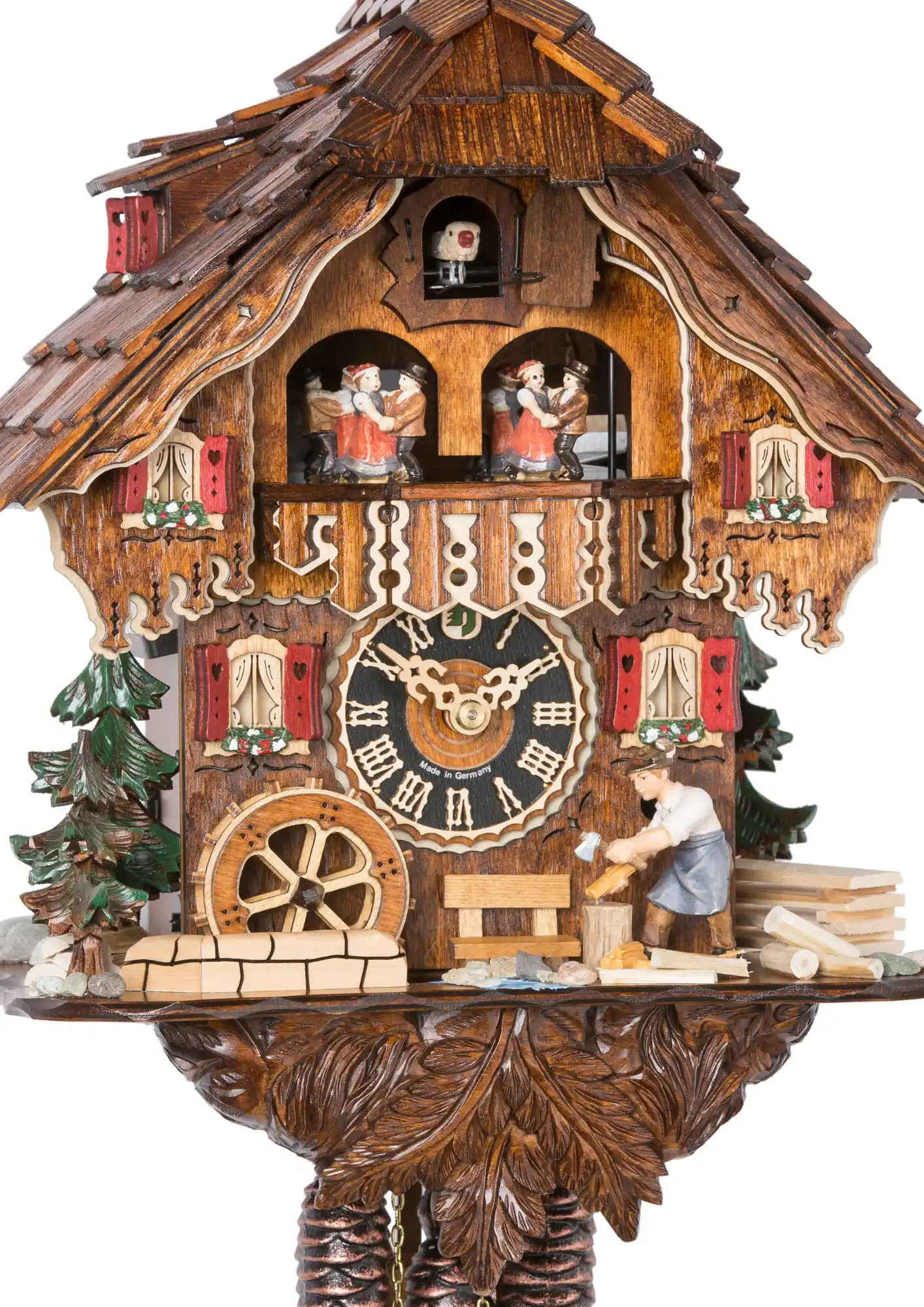 Cuckoo Clock Woodchopper 1 Day Movement wtih Music (2) Chalet style cuckoo clock, with solid base and unusual red-painted shutters. Not only is the roof eye-catching, but upon having a closer look, it is easy to spot very precise carvings on the balcony, pendulum, and even on the cuckoo door! The clock also s