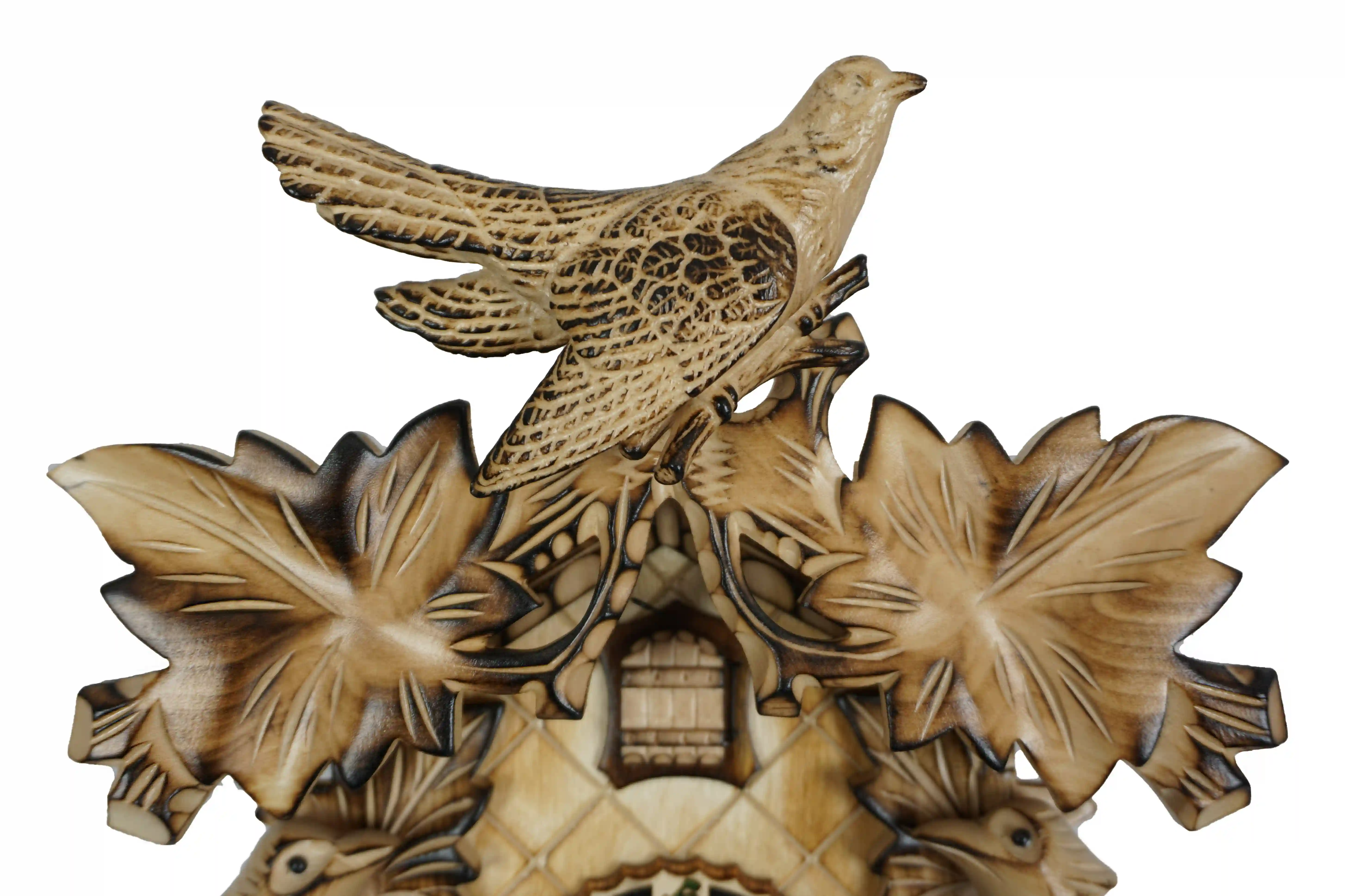 Cuckoo Clock Natural Color Wood 8 Day Movement (5) Middle sized traditional hand carved beige mechanical cuckoo clock decorated with wine leaves and with three birds with 8 days mechanism, the clock is preserved in its natural wood color, made by Hönes