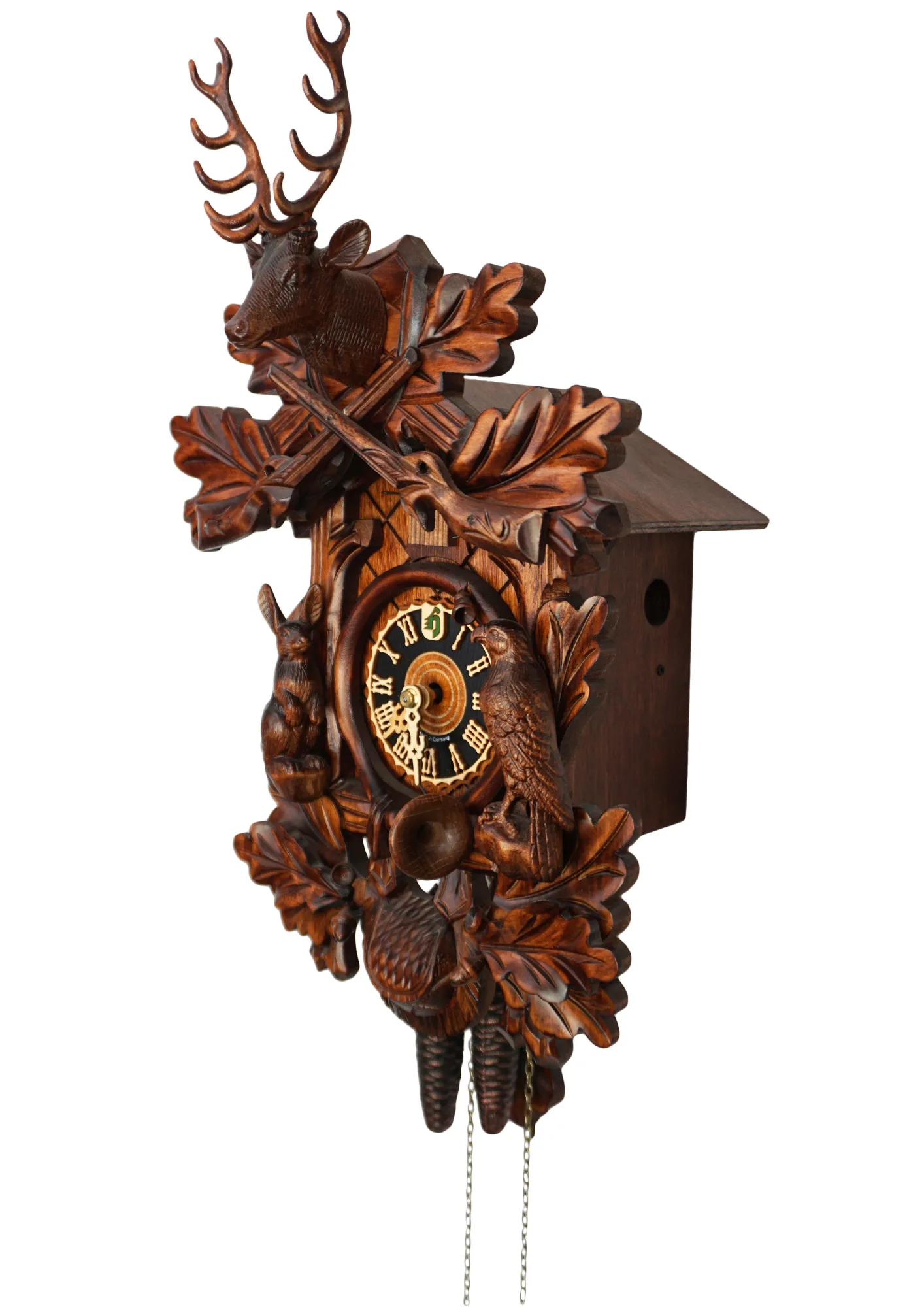 Hand carved traditional style brown mechanical black forest cuckoo clock with a hunting theme, decorated with deer head, rabbit and falcon