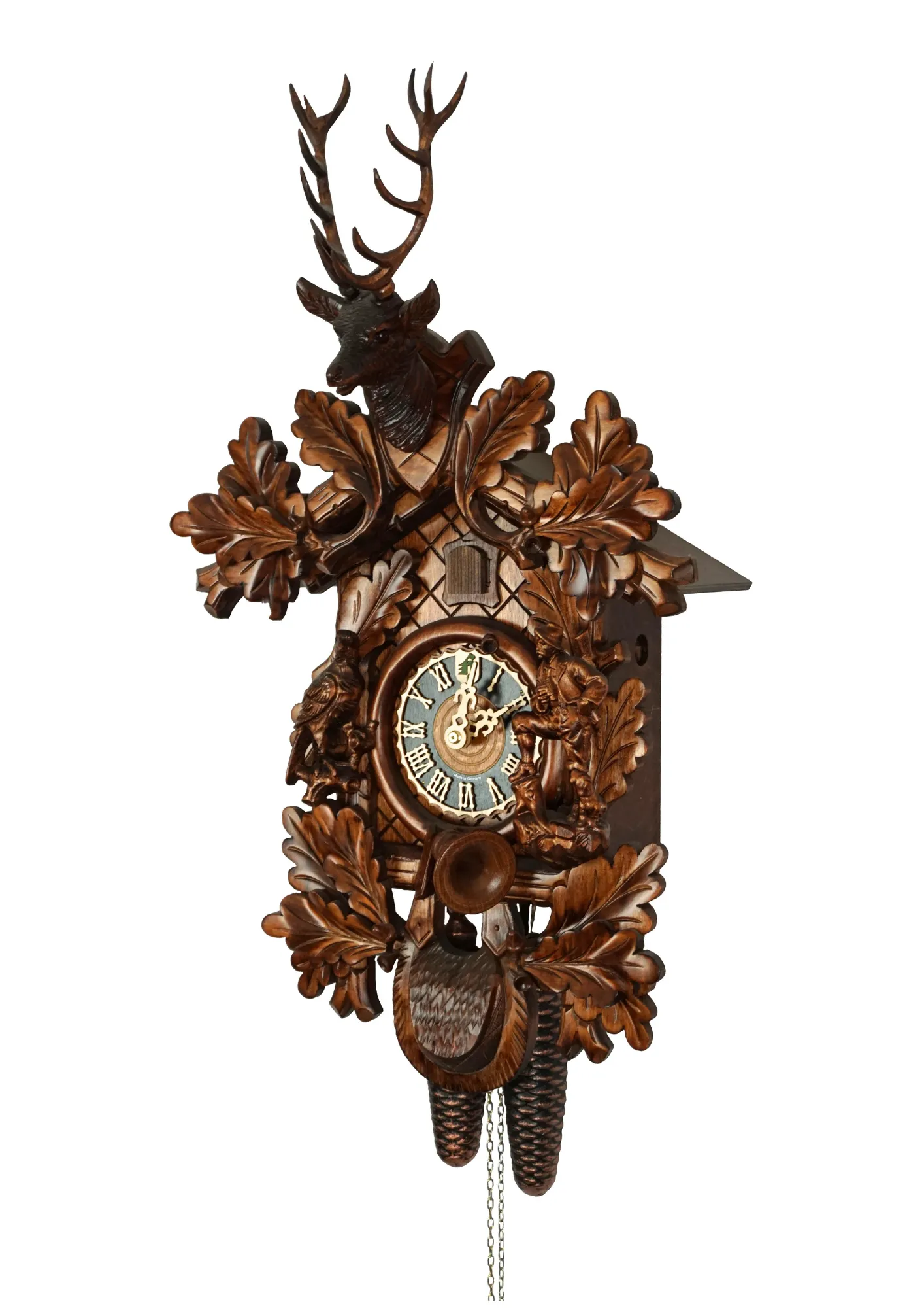 Hand carved authentic mechanical brown black forest cuckoo clock in a hunter theme. Precisely carved deer head is decorating the top while there is a hunter and a falcon figure on the sides of the clock. The clocks dial is wraped with a hunting horn while